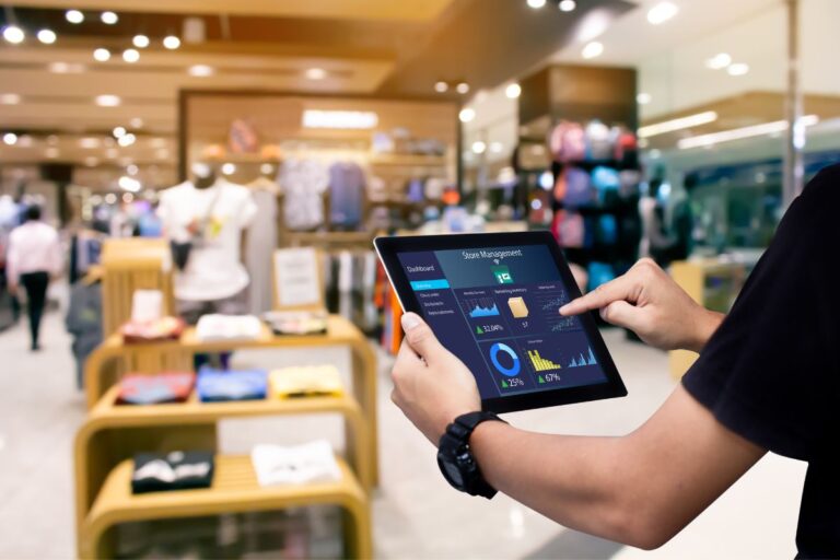 Employee-with-tab-managing-swag-store-online-768x512